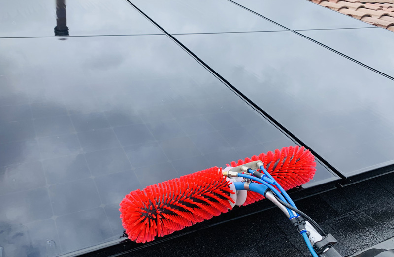 Cleaning residential solar panels.